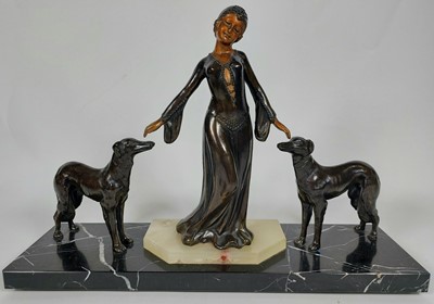 Lot 28 - An Art Deco spelter figural group on marble base