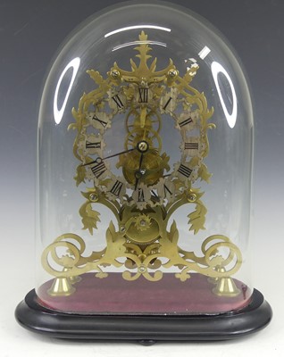 Lot 2509 - A Victorian style brass skeleton clock under...