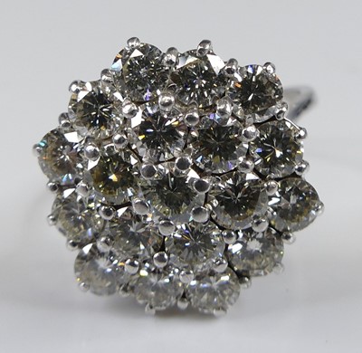 Lot 2269 - An 18ct white gold diamond circular cluster...