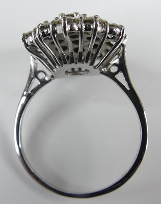 Lot 2502 - An 18ct white gold diamond circular cluster...