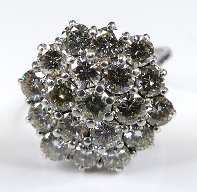 Lot 2502 - An 18ct white gold diamond circular cluster...