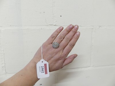 Lot 2502 - An 18ct white gold diamond circular cluster...