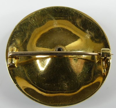 Lot 2520 - A yellow metal enamel circular brooch, having...