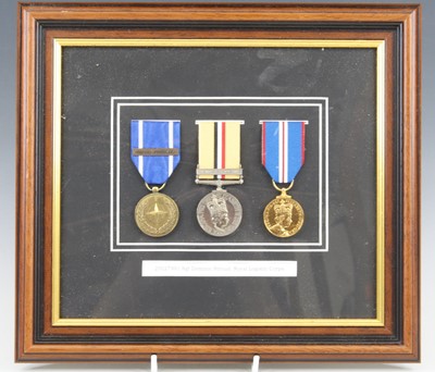 Lot 594 - A group of three medals to include Nato...