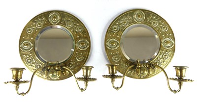 Lot 422 - A pair of Arts & Crafts floral embossed brass...