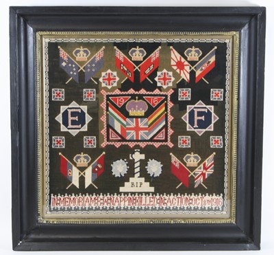 Lot 587 - A WW I woolwork memorial panel, the centre...