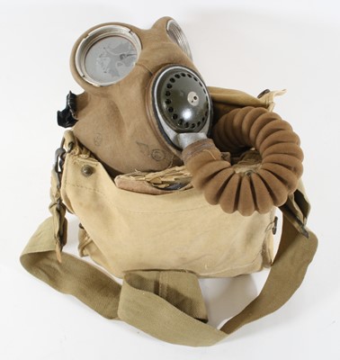 Lot 697 - A canvas gas mask by Dunlop Lot b 379, dated...