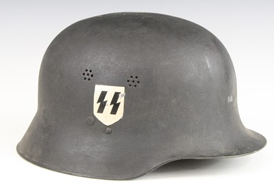 Lot 569 - A German Stahlhelm, later painted with SS...