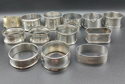 Lot 280 - Twelve silver napkin rings, 7.210 ozt