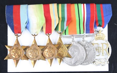 Lot 725 - A group of seven medals to include WW II...