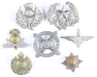 Lot 561 - A collection of assorted cap badges and...