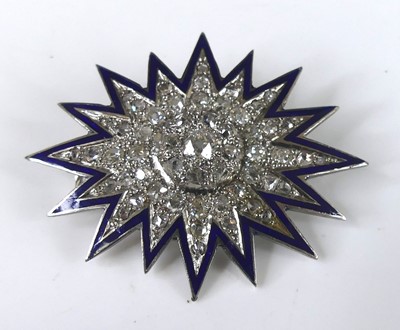 Lot 2236 - A white metal diamond 16-ray star...