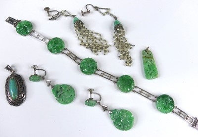 Lot 2264 - A 9ct white gold and jade bracelet, arranged...