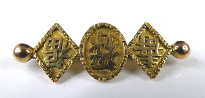 Lot 2282 - A Chinese 18ct gold bar brooch, arranged as...