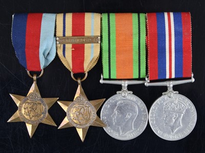 Lot 611 - A group of four WW II medals to include...