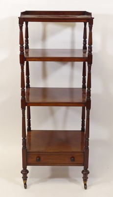 Lot 2554 - A late Regency mahogany four-tier...