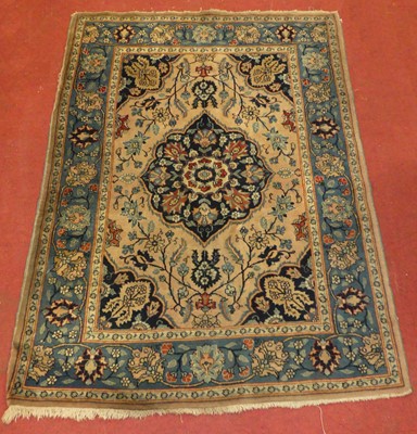 Lot 2553 - A Persian woollen Tabriz rug, having a peach...