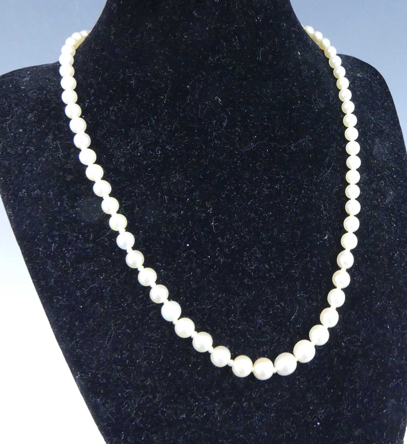 Lot 2503 - A cultured pearl necklace, arranged as 67...