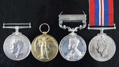 Lot 738 - A group of four medals to include WW I British...