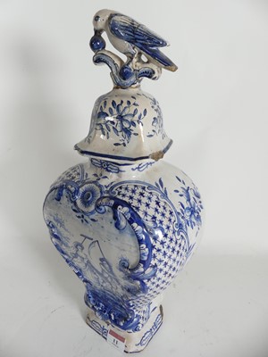 Lot 11 - An 18th century Delft vase and cover of upper...