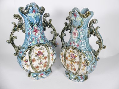 Lot 16 - A pair of twin handled late 19th century vases,...