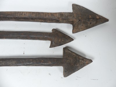 Lot 47 - Three carved wooden arrows, longest length 80cm