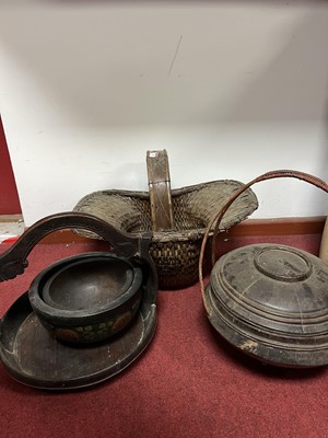 Lot 81 - A collection of oriental baskets wooden dishes...