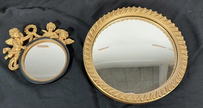 Lot 98 - A gilt framed convex wall mirror, in the...