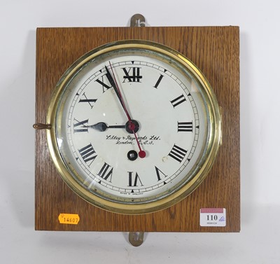 Lot 110 - A brass cased ship's bulkhead clock, the...