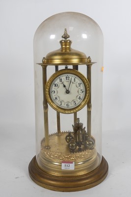 Lot 112 - A brass anniversary clock having white enamel...