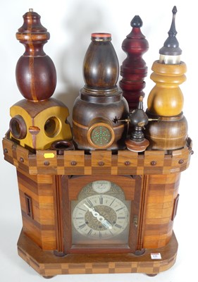 Lot 135 - A large wooden clock made from various...