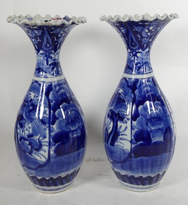 Lot 143 - A pair of blue & white oriental vases