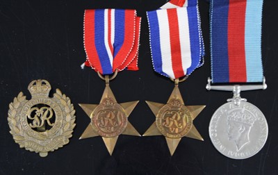 Lot 666 - A group of three WW II medals to include...