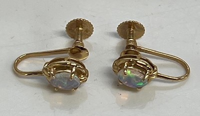 Lot 322 - A pair of 14ct gold and cabochon opal set ear...