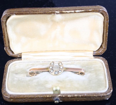 Lot 330 - A 9ct gold and seed pearl set horseshoe safety...