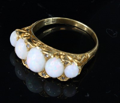 Lot 356 - An Edwardian 18ct gold opal half-hoop ring,...