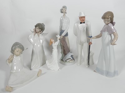 Lot 198 - A collection of ceramic figures to include two...