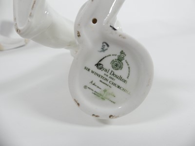 Lot 198 - A collection of ceramic figures to include two...