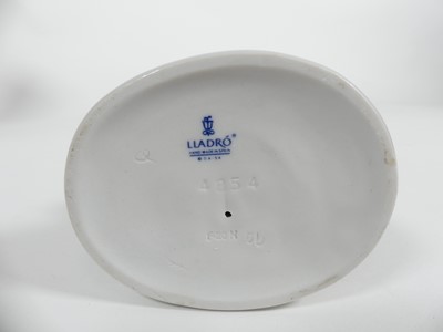 Lot 198 - A collection of ceramic figures to include two...