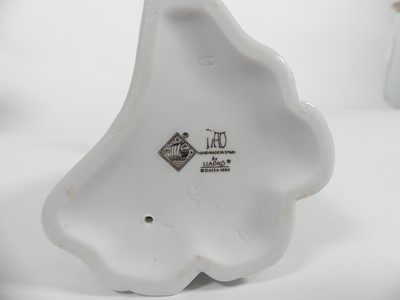 Lot 198 - A collection of ceramic figures to include two...