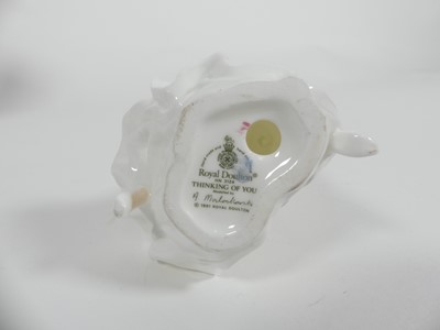 Lot 198 - A collection of ceramic figures to include two...