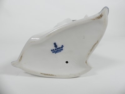 Lot 198 - A collection of ceramic figures to include two...