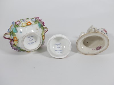 Lot 239 - A Coalport flower encrusted twin handled pot...