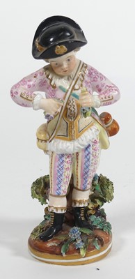 Lot 240 - A  Crown Derby figure of a boy holding flowers,...