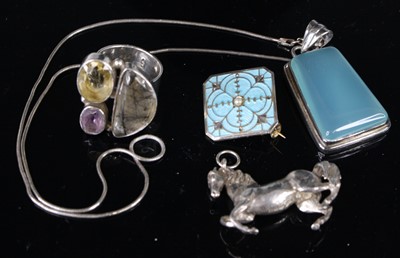 Lot 385 - A modern silver pendant of a galloping horse,...