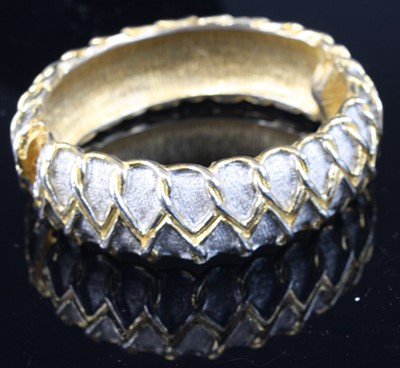 Lot 409 - A Ken Lane gilt metal hinged bangle, 7.2cm, in...