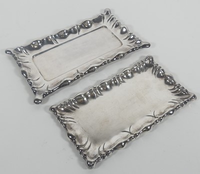 Lot 311 - A white metal tray of shaped rectangular form,...