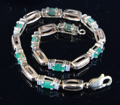 Lot 415 - A contemporary 9ct gold, emerald and diamond...