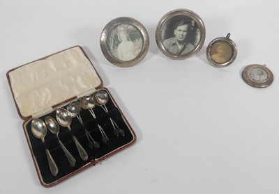 Lot 317 - A collection of silver to include coffee spoon...