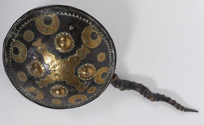 Lot 564 - An Indo-Persian circular style hand shield...